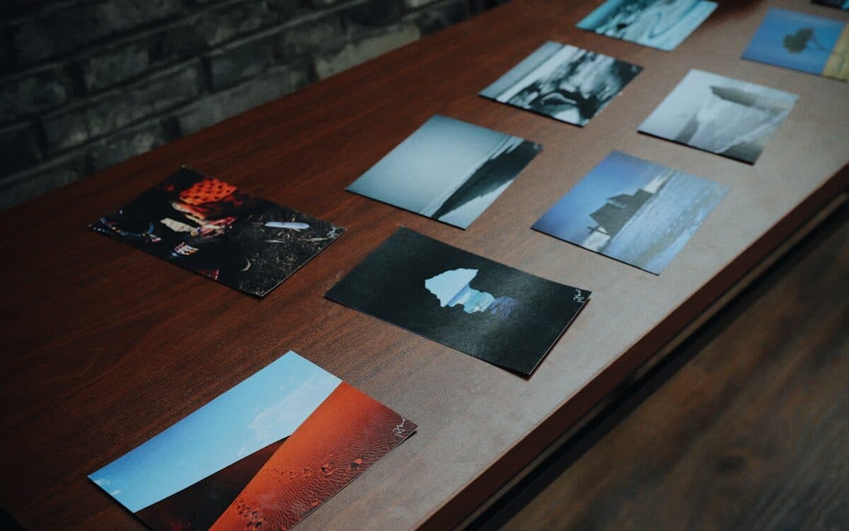 A set of finished prints laid out across a dark table, one look running through all of them